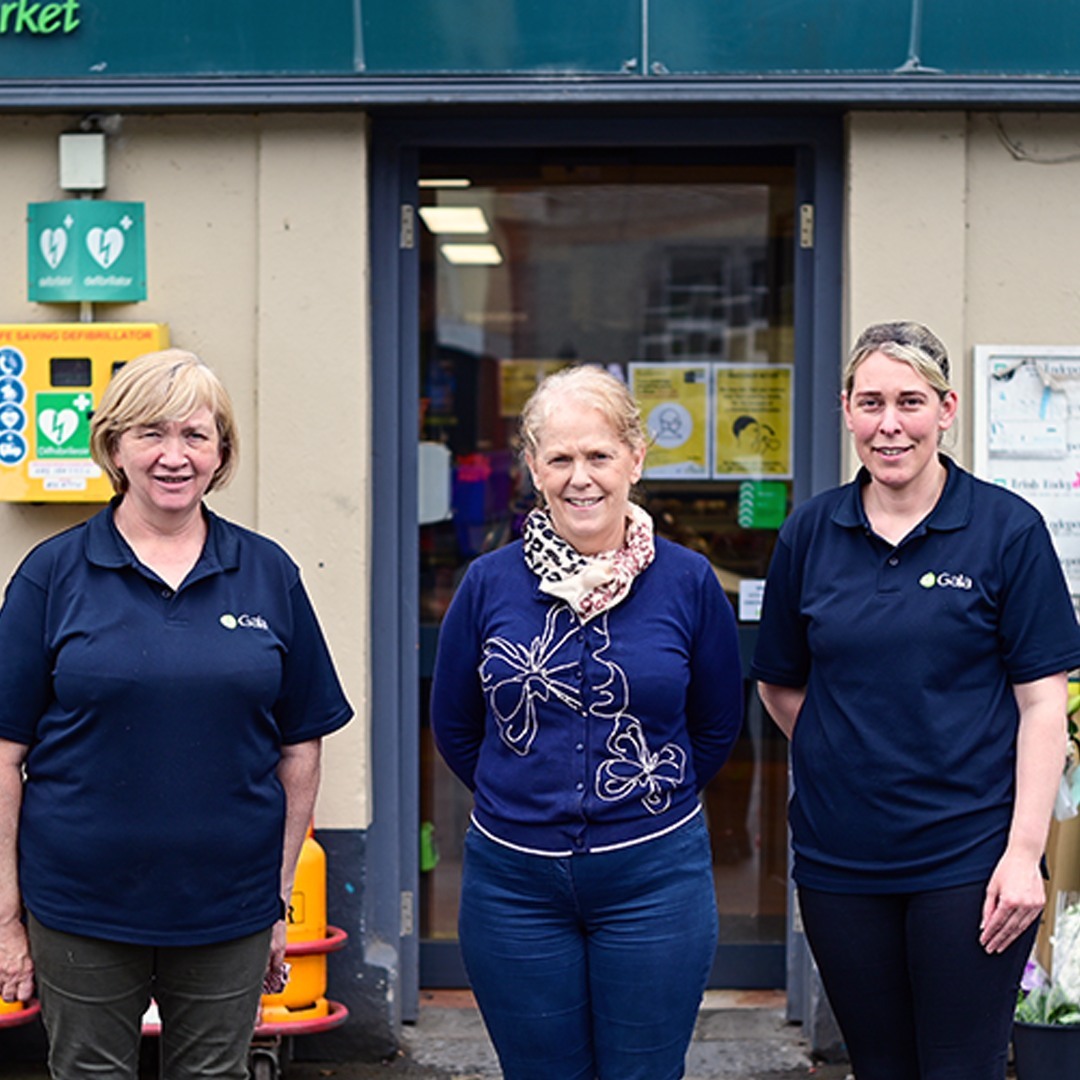 Three members of the Simpson's Gala team in the doorway of the shop on Main Street, Stradbally